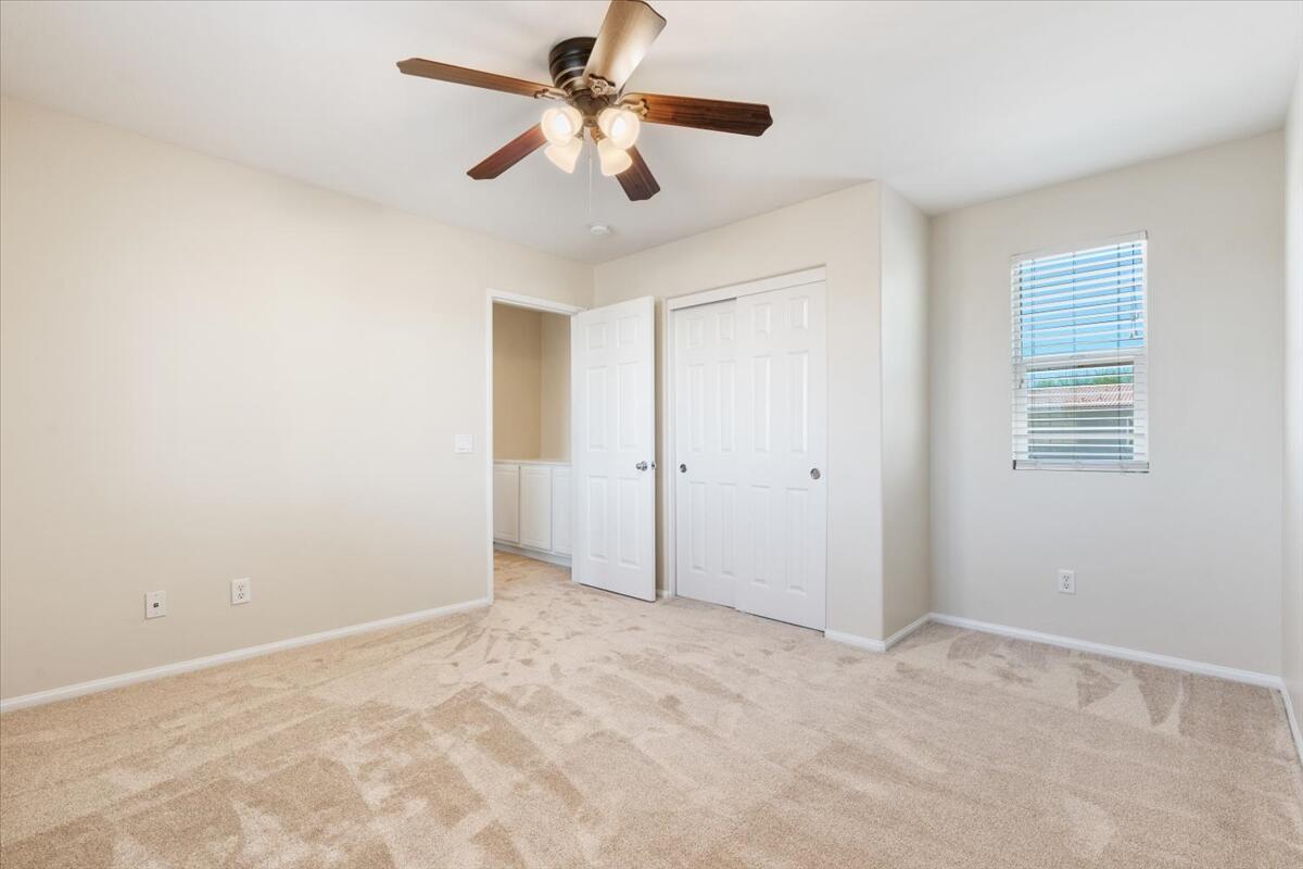 82732 Castleton Drive Indio, CA 92203 - Photo 27 of 45 an empty room with closet and a ceiling fan