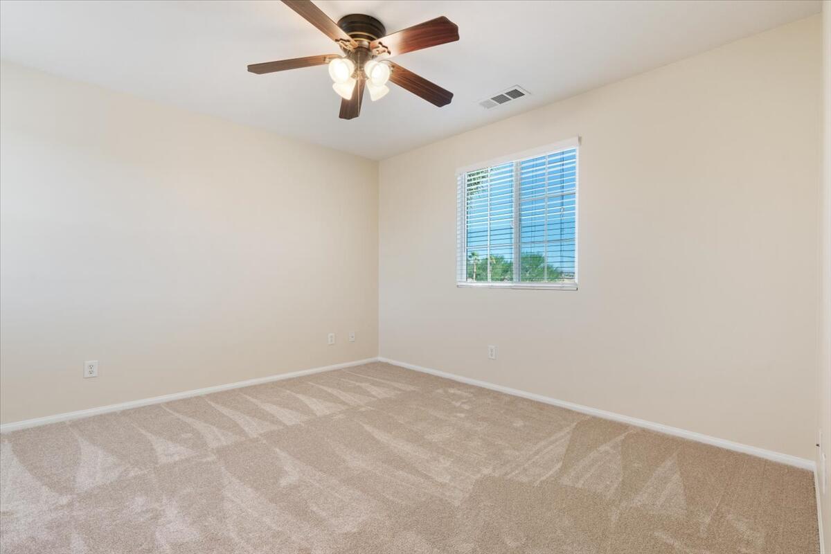 82732 Castleton Drive Indio, CA 92203 - Photo 28 of 45 an empty room with a window and a fan