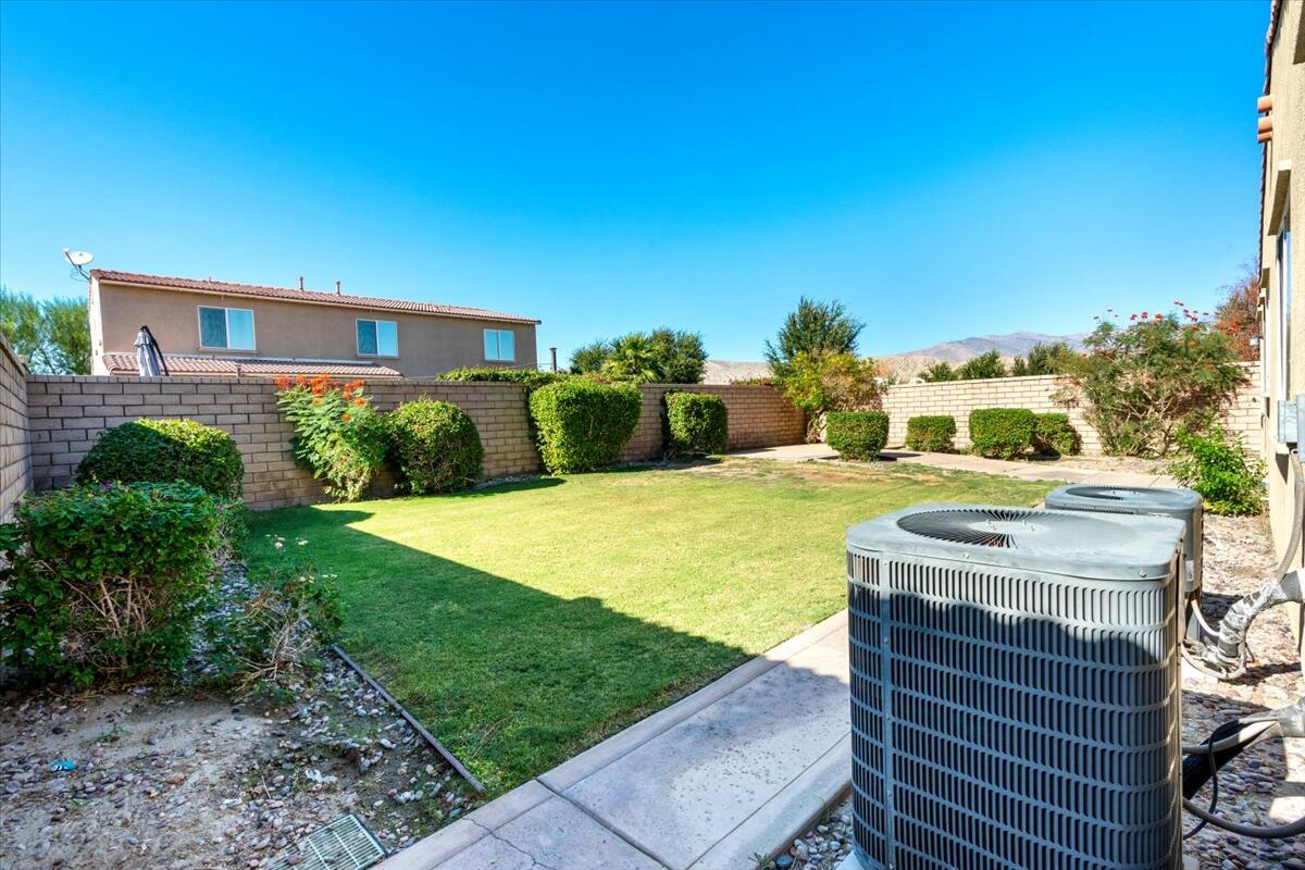 82732 Castleton Drive Indio, CA 92203 - Photo 33 of 45 a view of a house with a yard