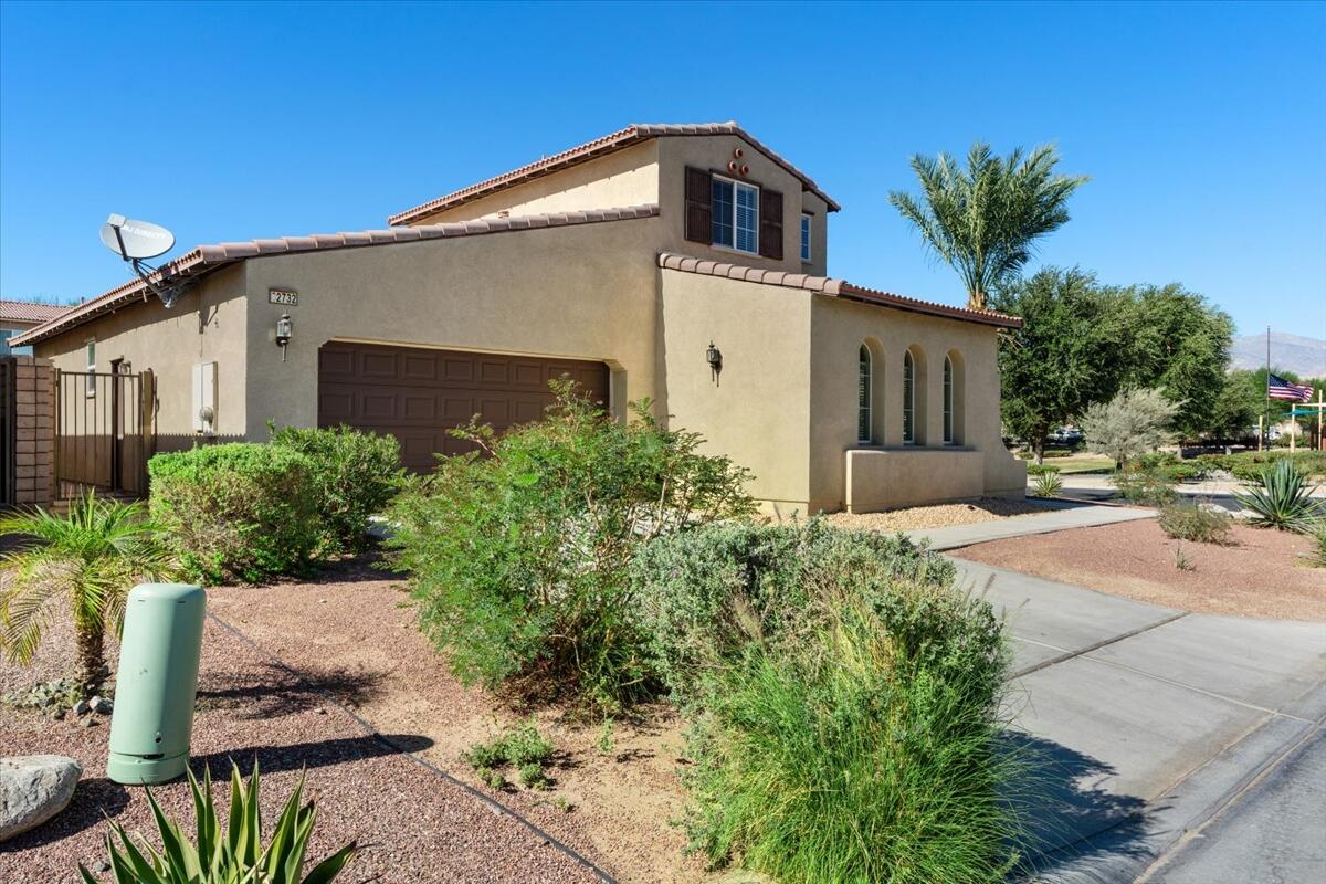 82732 Castleton Drive Indio, CA 92203 - Photo 42 of 45 a front view of a house with a yard