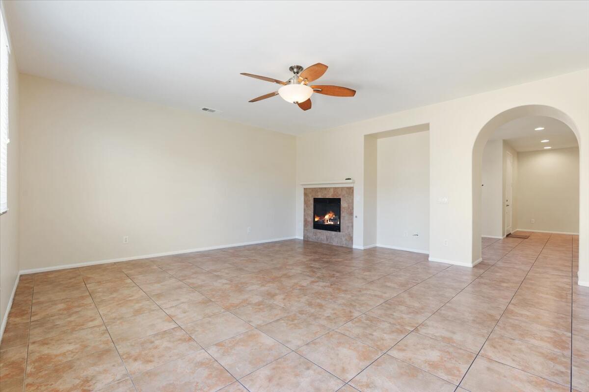 82732 Castleton Drive Indio, CA 92203 - Photo 6 of 45 an empty room with closet and a chandelier fan