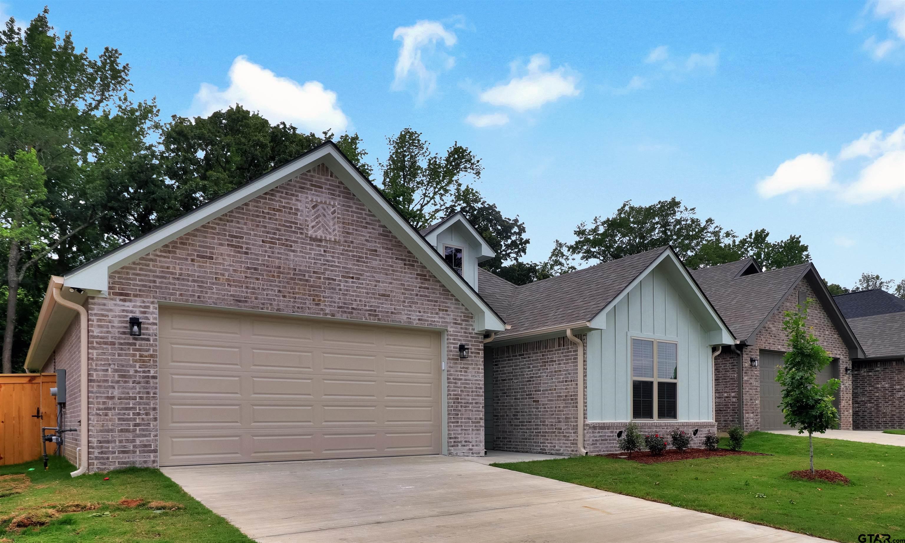 3053 Guinn Farms Road Tyler, TX 75707 - Photo 29 of 32 a view of a house with a yard