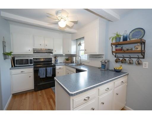 14 Rachel Street Springfield, MA 01129 - Photo 8 of 25 a kitchen with kitchen island granite countertop a sink cabinets and stainless steel appliances