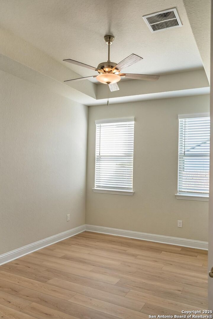 5209 Pinder Way Marion, TX 78124 - Photo 4 of 8 a view of a livingroom with a ceiling fan and wooden floor