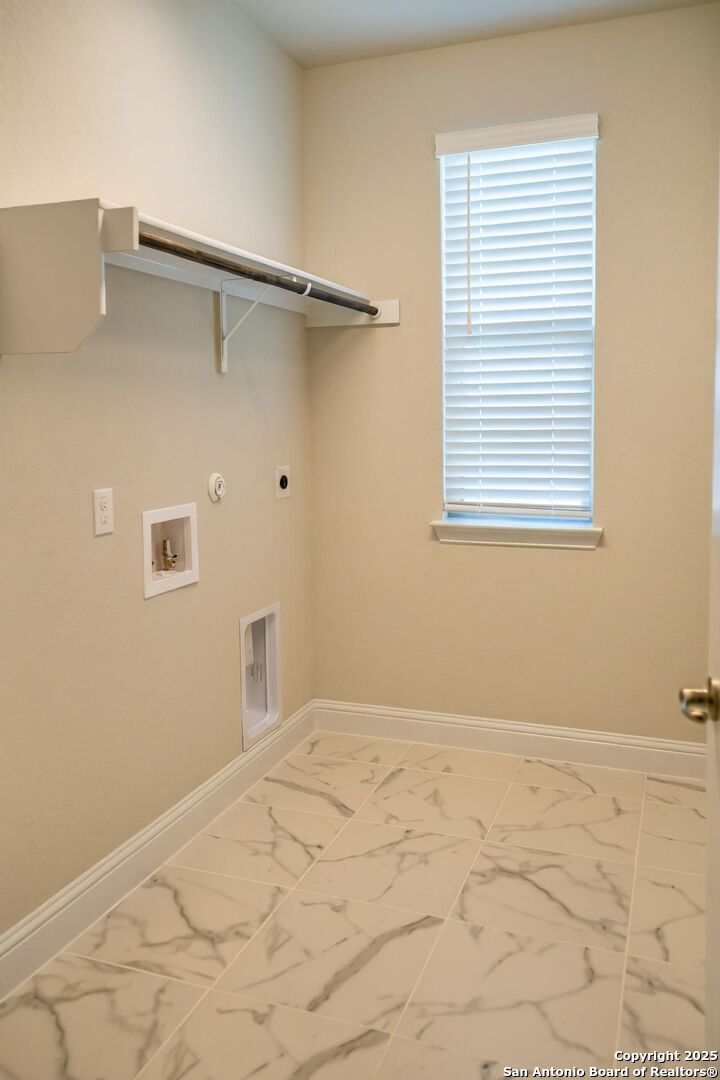 5209 Pinder Way Marion, TX 78124 - Photo 5 of 8 a view of a room that has a window in it