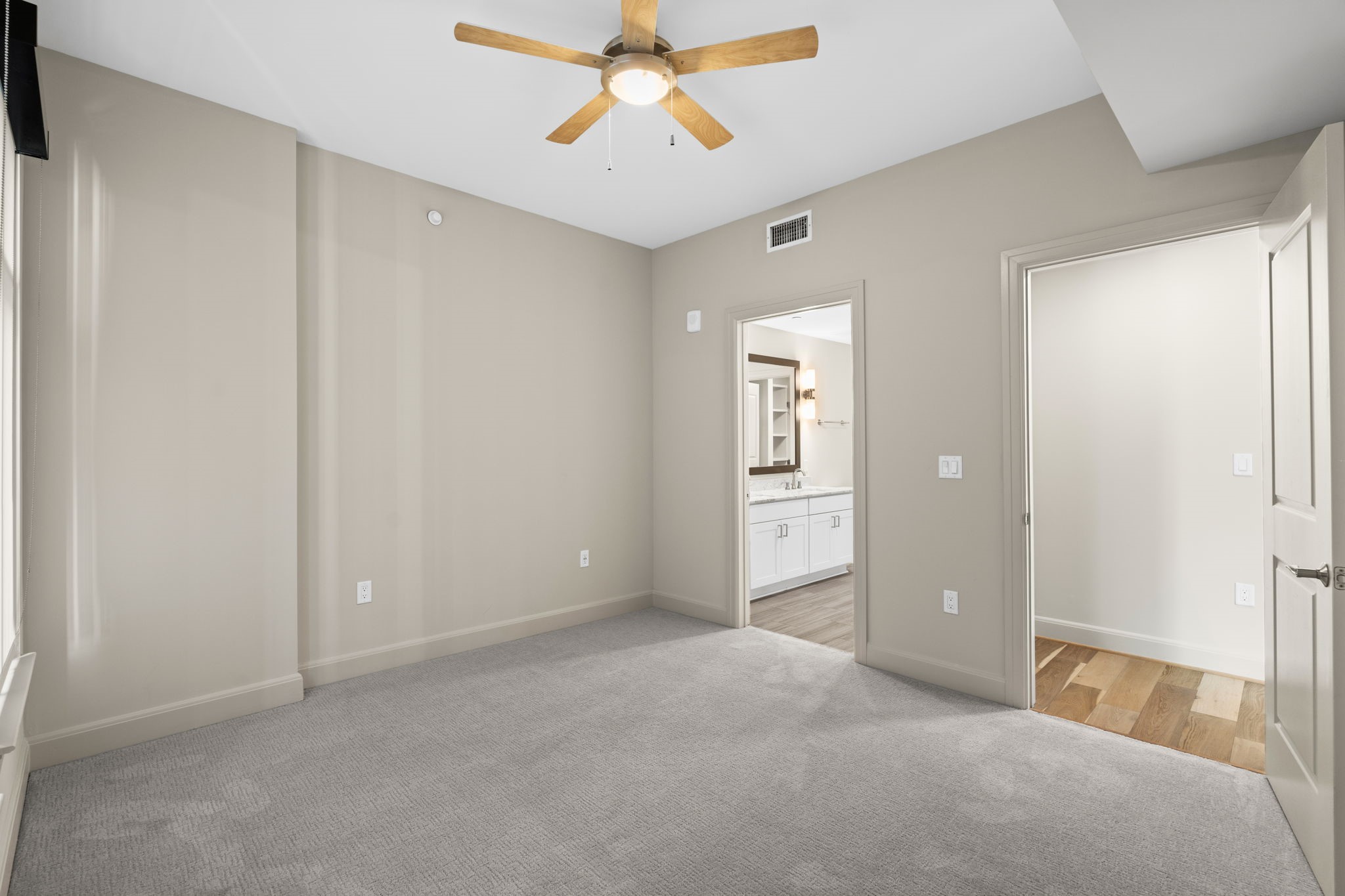 2511 Willowick Road, Unit 551 Houston, TX 77027 - Photo 15 of 45 an empty room with windows and fan