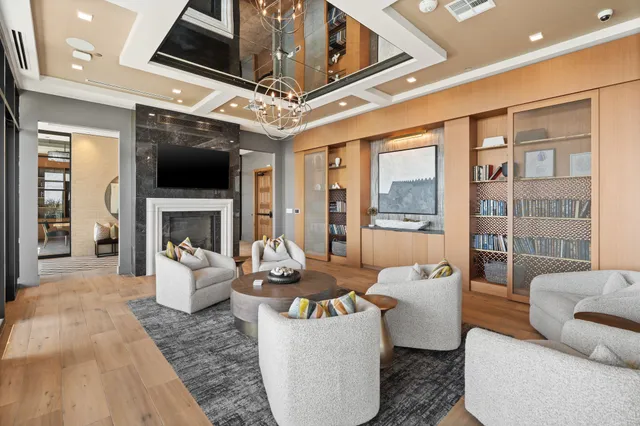 a living room with fireplace furniture and a flat screen tv