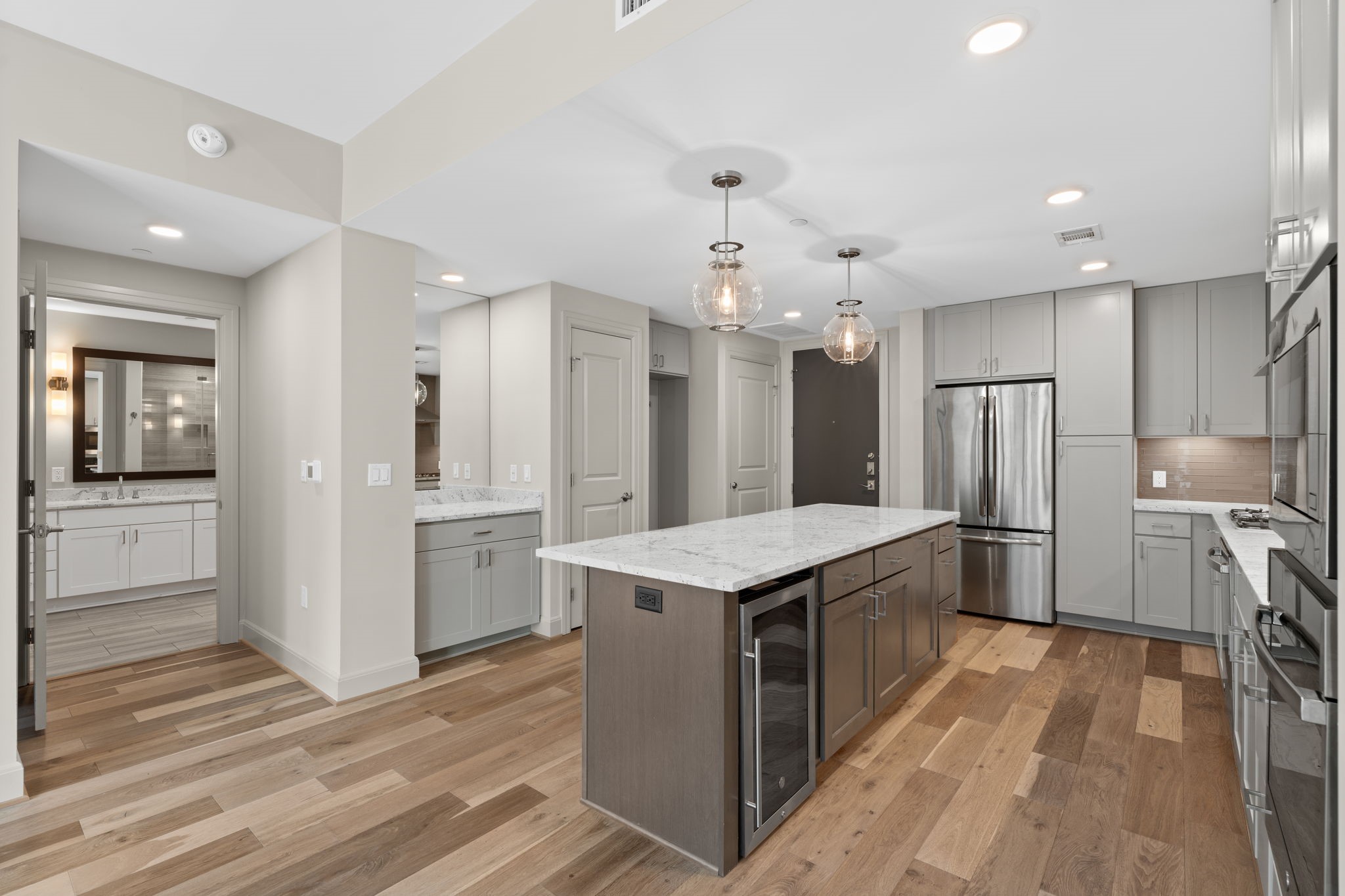 2511 Willowick Road, Unit 551 Houston, TX 77027 - Photo 4 of 45 a kitchen with stainless steel appliances granite countertop a refrigerator a stove a sink and a oven
