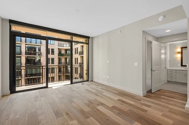 a view of an empty room with a window