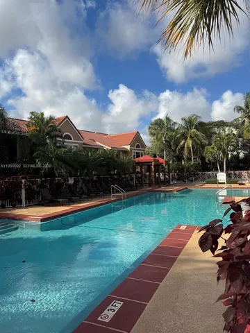 a view of a hallway with wooden shelves