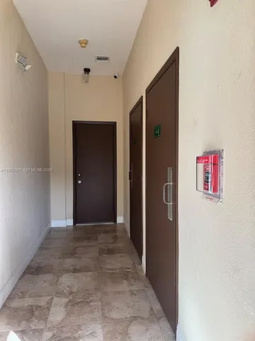 a view of a patio with swimming pool and furniture