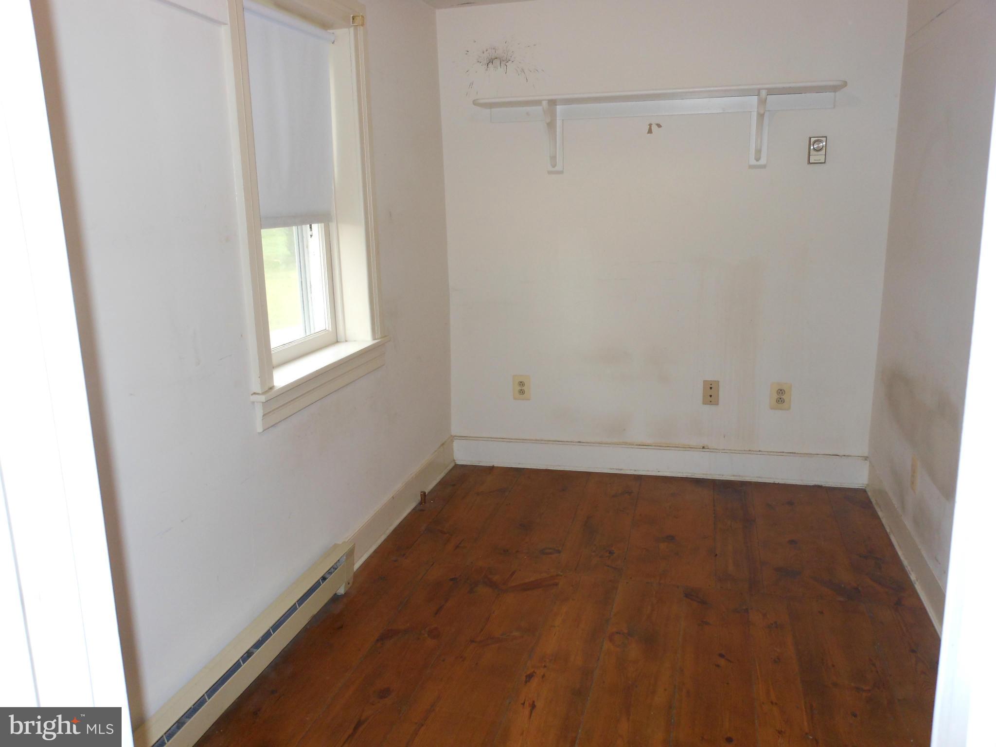 21715 Middletown Road Freeland, MD 21053 - Photo 12 of 30 a view of a small space with wooden floor and white walls
