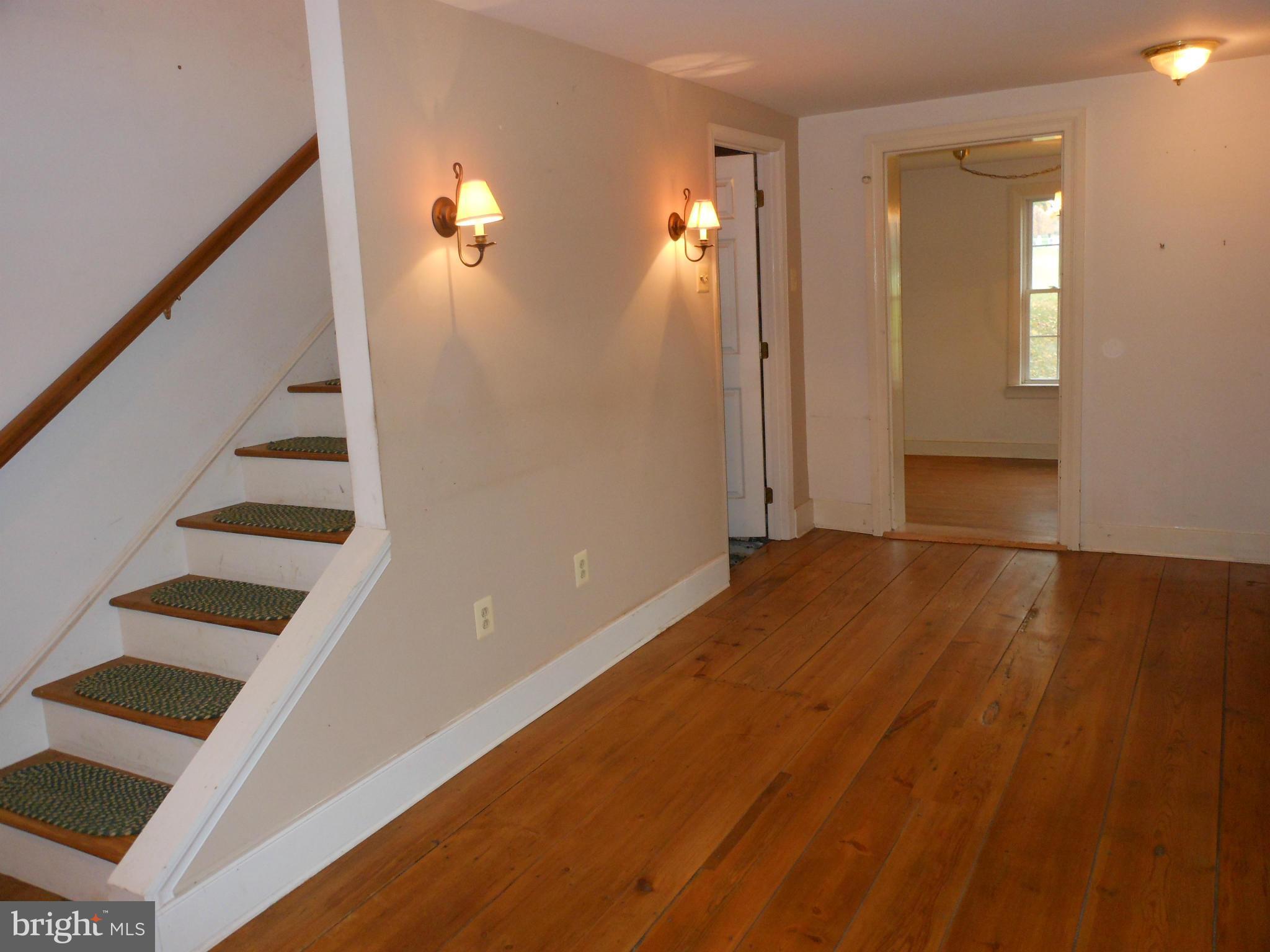 21715 Middletown Road Freeland, MD 21053 - Photo 4 of 30 a view of a room with wooden floor and staircase