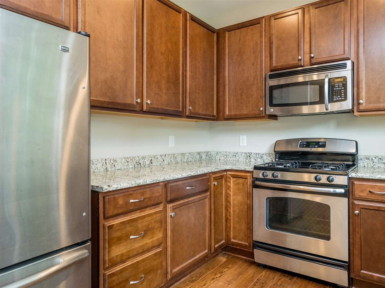 2308 Milburnie Road Raleigh, NC 27610 - Photo 9 of 25 The well-appointed kitchen has granite counters and stainless appliances. Kitchen
