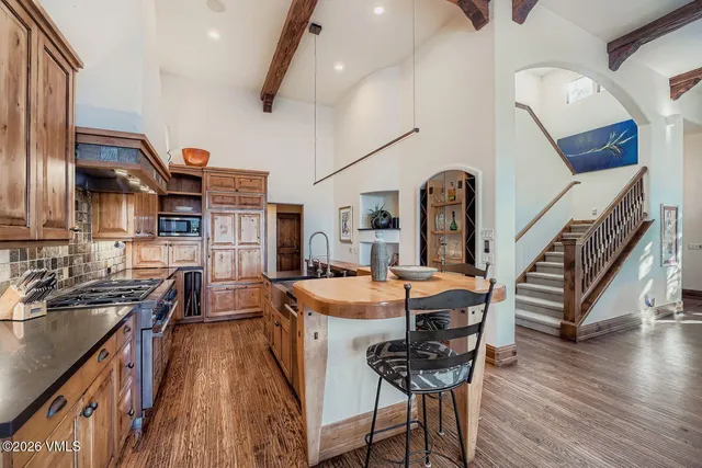 a dining room with furniture and wooden floor