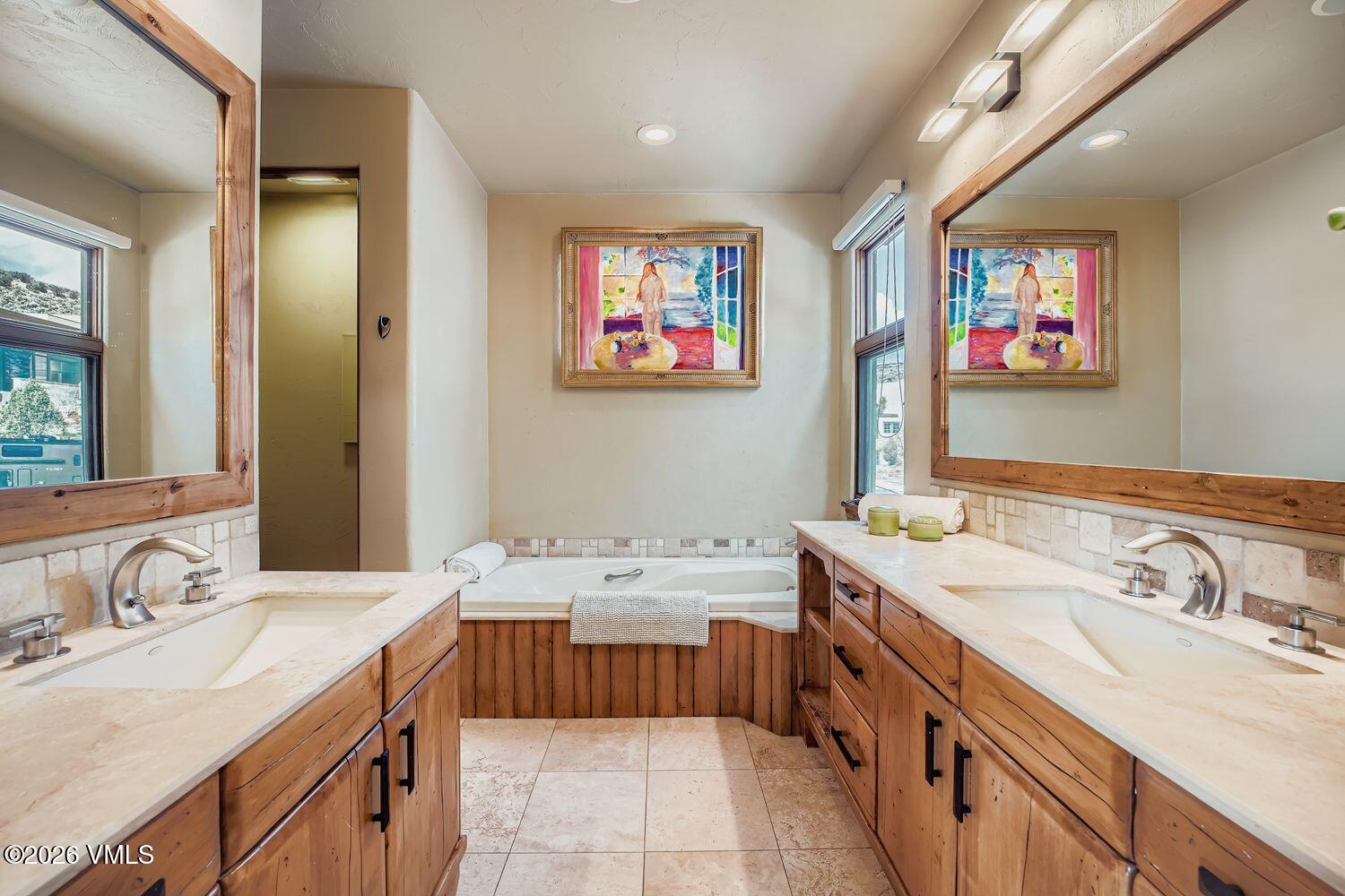 311 Foal Drive Edwards, CO 81632 - Photo 18 of 29 a bathroom with a sink double vanity granite and a mirror