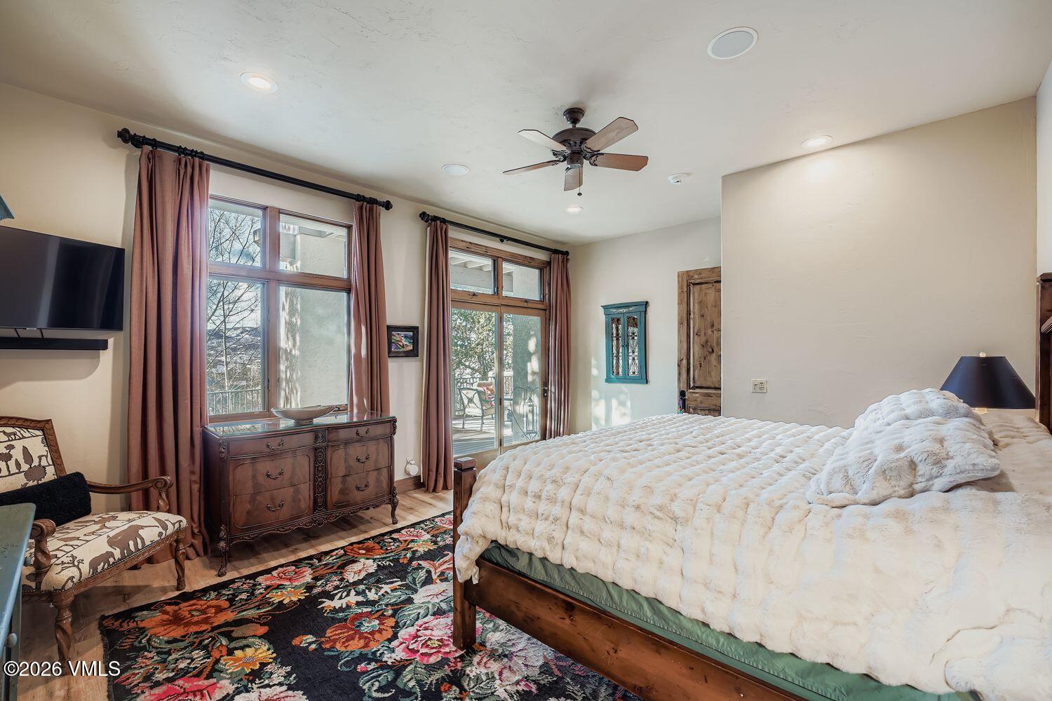 311 Foal Drive Edwards, CO 81632 - Photo 23 of 29 a bedroom with a bed flat screen tv and windows