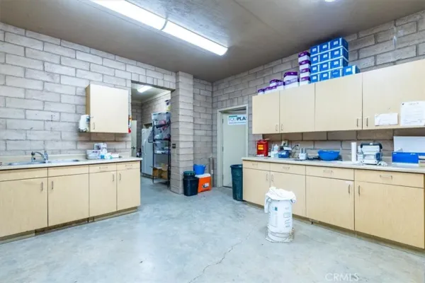 a view of a swimming pool with outdoor seating and city view