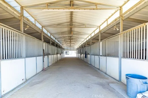 a view of a blue chair and table in the patio