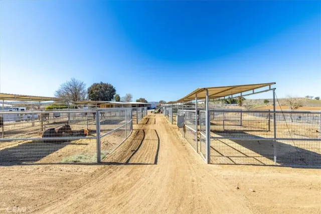 an aerial view of a house with a yard basket ball court and outdoor seating