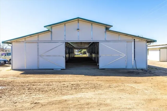 a view of a chairs and table in the patio