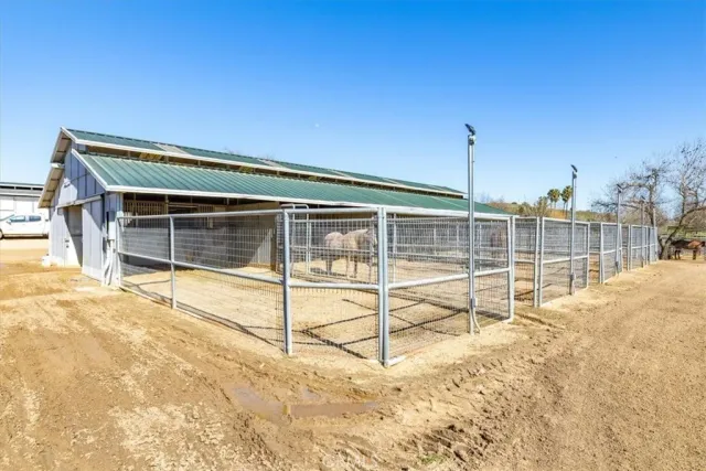 a view of a lake with lawn chairs