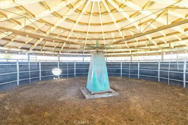 an aerial view of residential houses with outdoor space and parking
