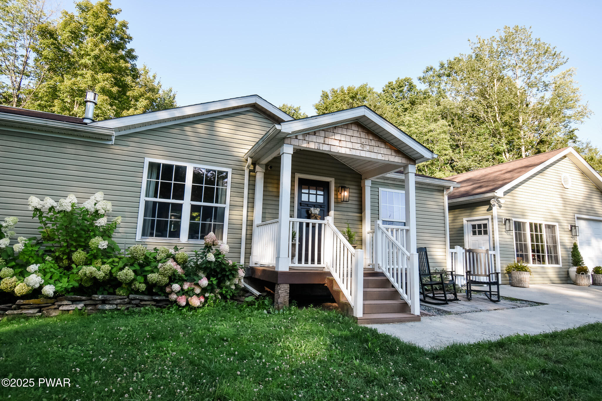 66 Wash Road Waymart, PA 18472 - Photo 3 of 41 a front view of a house with a yard glass top table and chairs