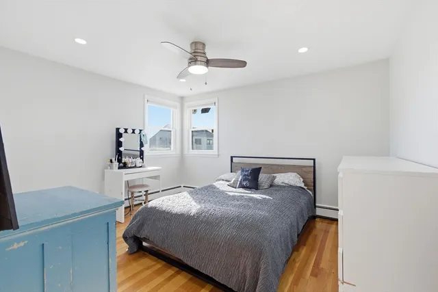 a bedroom with a bed and a table in it