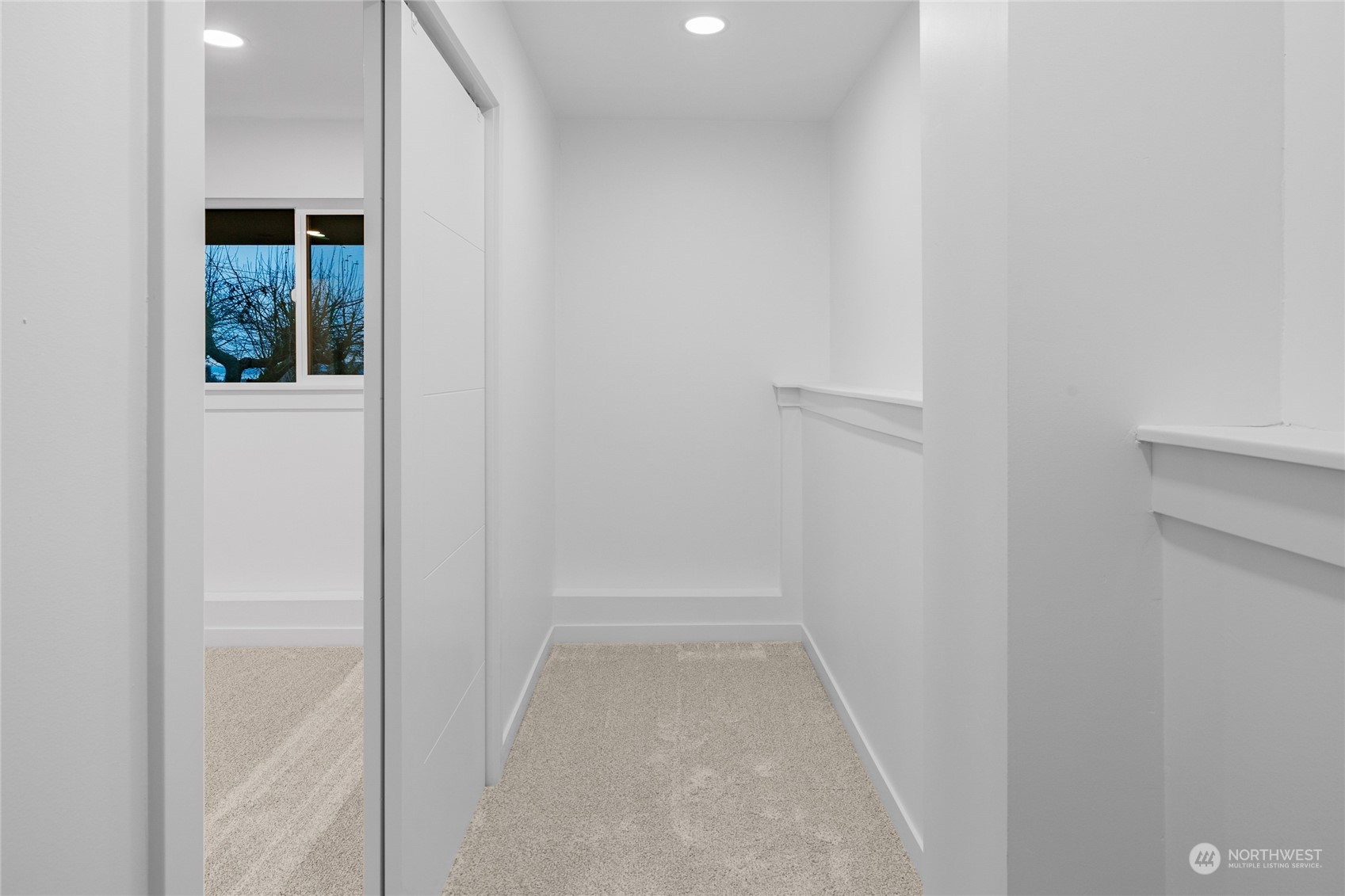 815 Rowell Street Steilacoom, WA 98388 - Photo 18 of 34 a view of a hallway with wooden floor