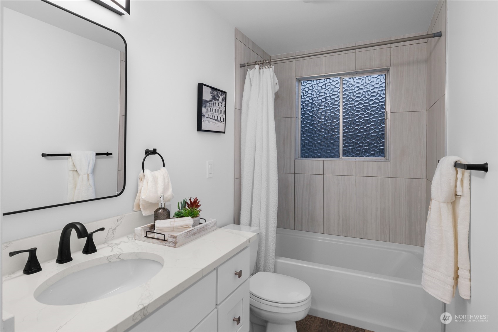 815 Rowell Street Steilacoom, WA 98388 - Photo 20 of 34 a bathroom with a sink toilet and shower