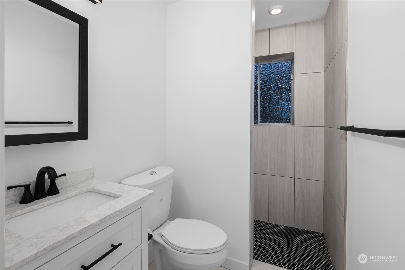 815 Rowell Street Steilacoom, WA 98388 - Photo 21 of 34 a bathroom with a toilet sink and vanity