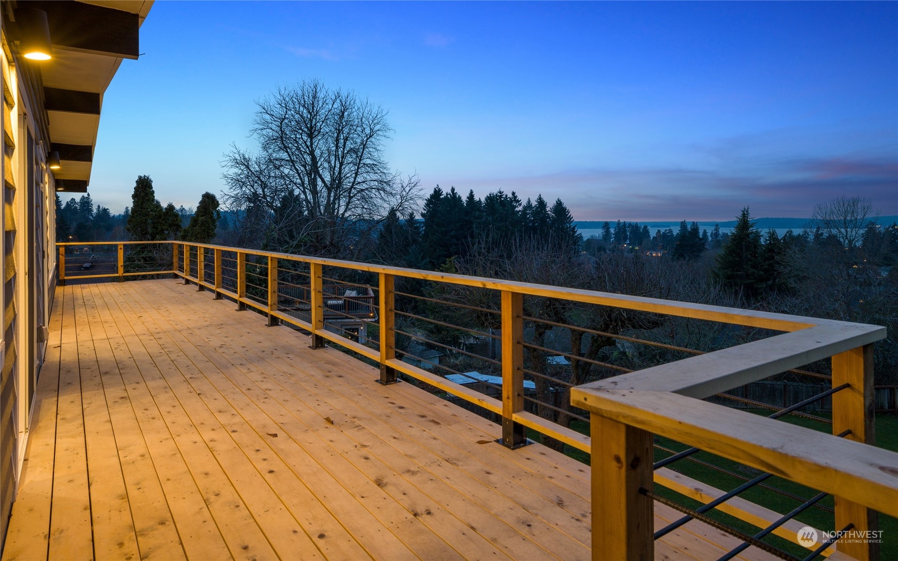 815 Rowell Street Steilacoom, WA 98388 - Photo 3 of 34 a view of balcony with two chairs and wooden fence