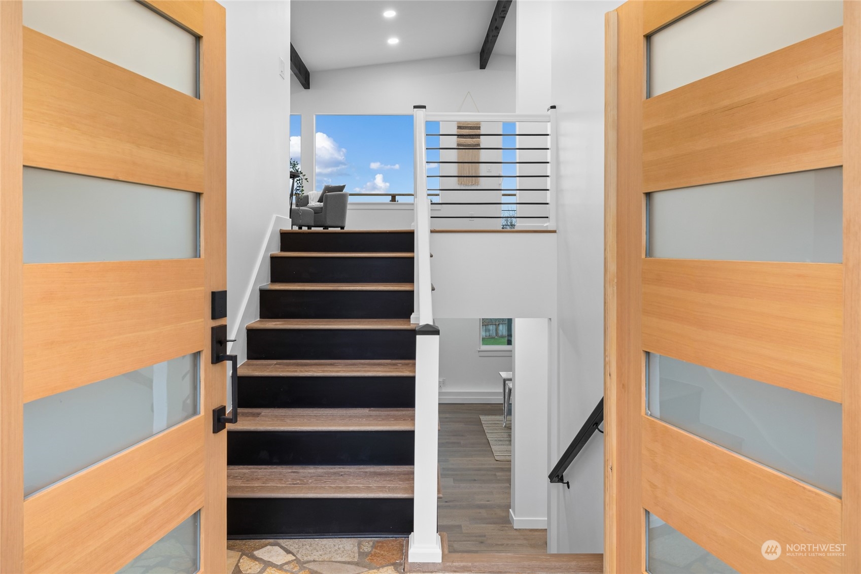 815 Rowell Street Steilacoom, WA 98388 - Photo 4 of 34 a view of entryway and hall with wooden floor