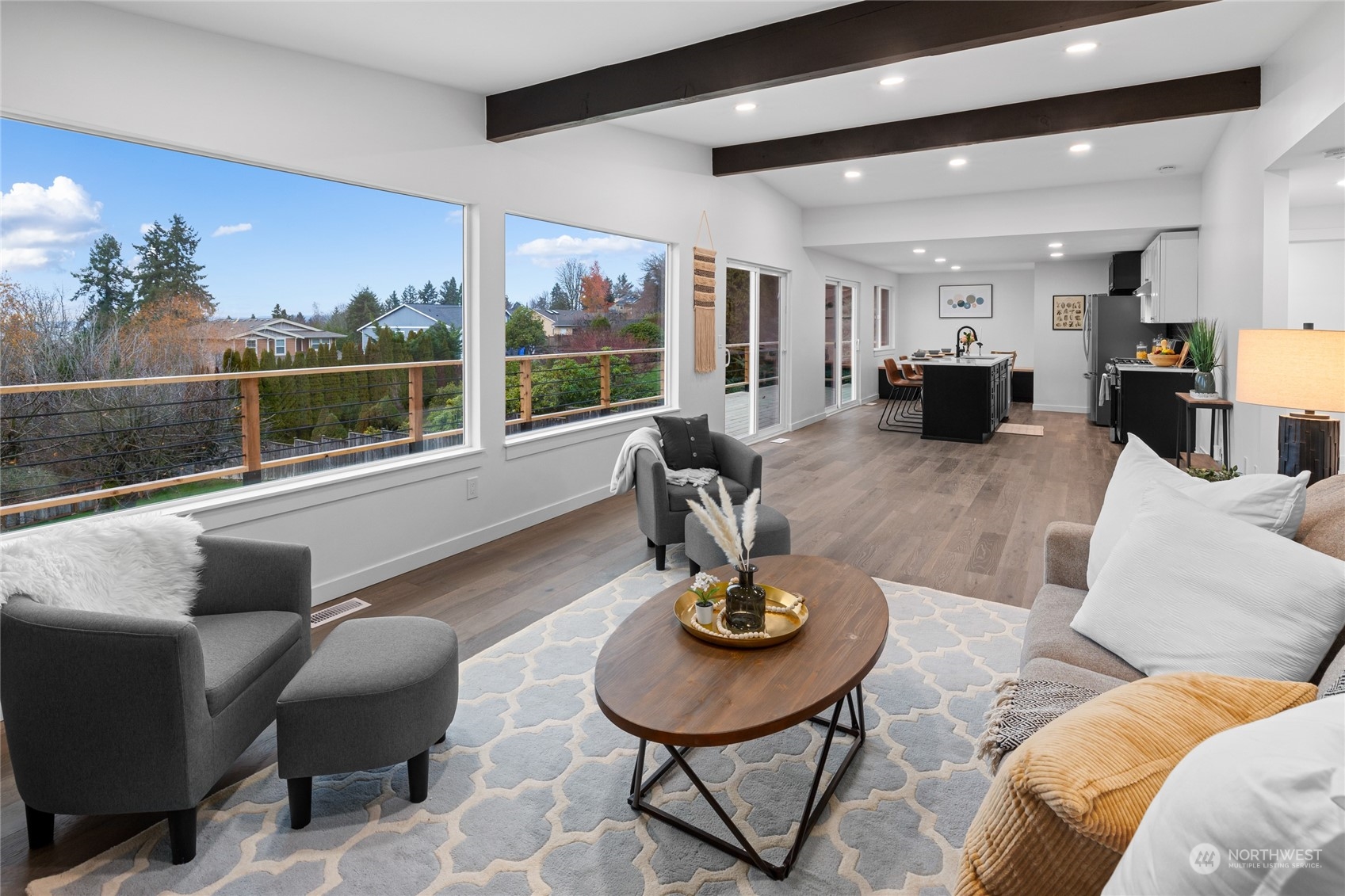 815 Rowell Street Steilacoom, WA 98388 - Photo 9 of 34 a living room with furniture kitchen view and a large window