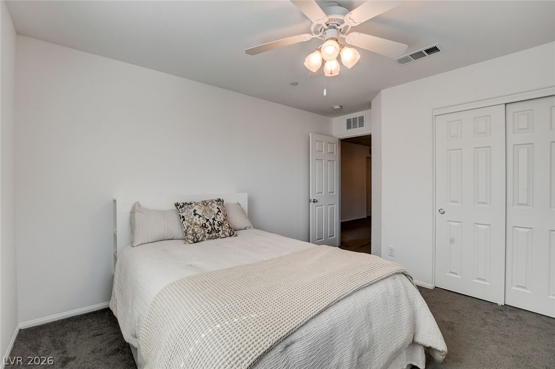 484 Filaree Place Henderson, NV 89015 - Photo 33 of 71 This cozy room features a ceiling fan and convenient closet access, creating a comfortable living space.