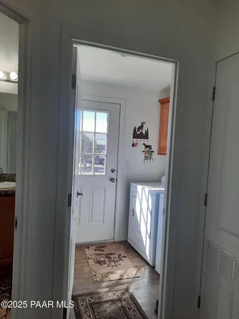 a bedroom with a bed and a night stand