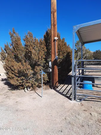 a view of a road with a snow in the background
