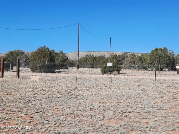 a black and white photo of a tennis court