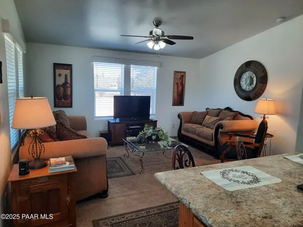 a kitchen that has a table and chairs in it