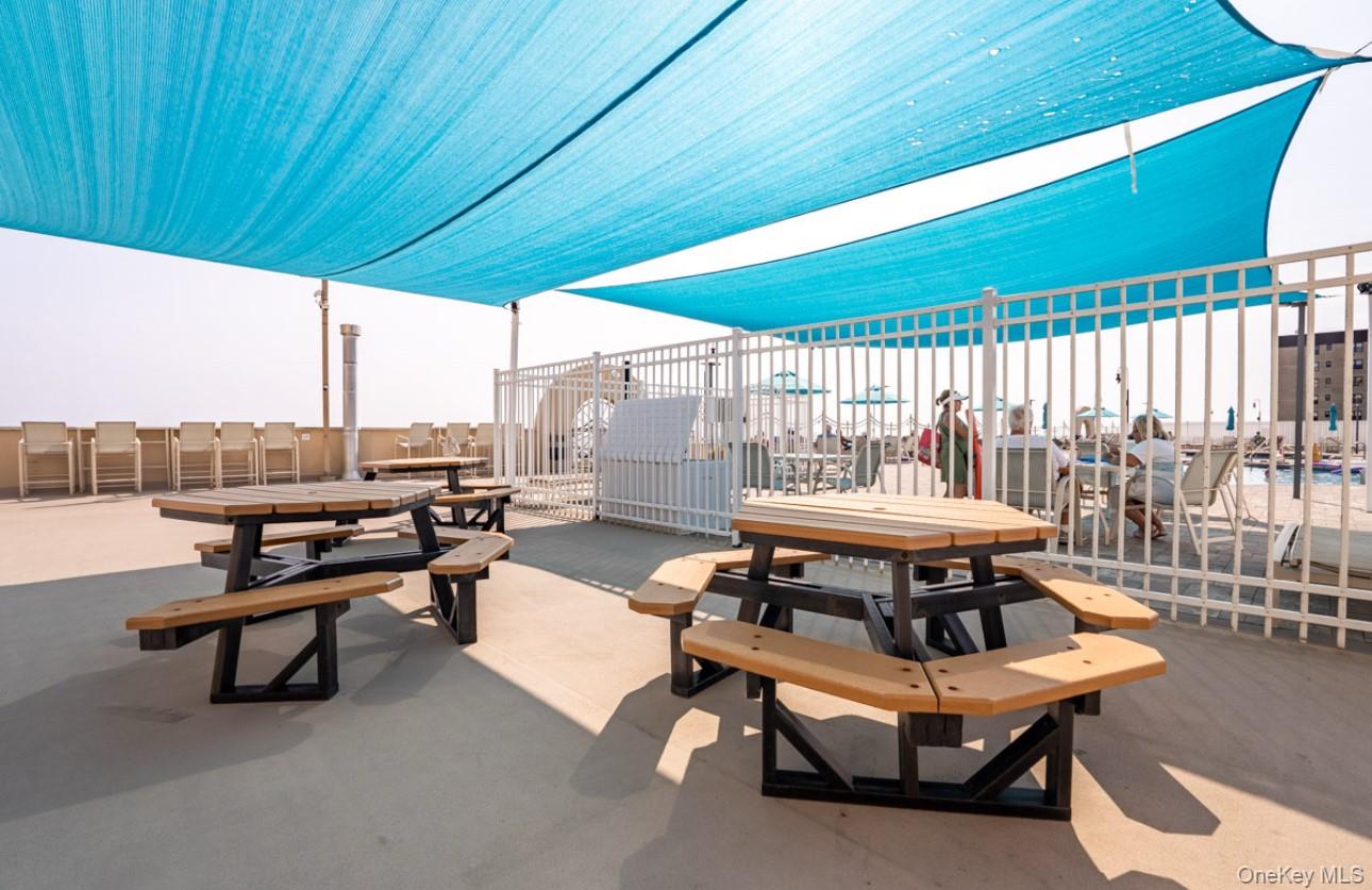 360 Shore Road, Unit 4B Long Beach, NY 11561 - Photo 7 of 28 View of patio / terrace featuring outdoor dining area