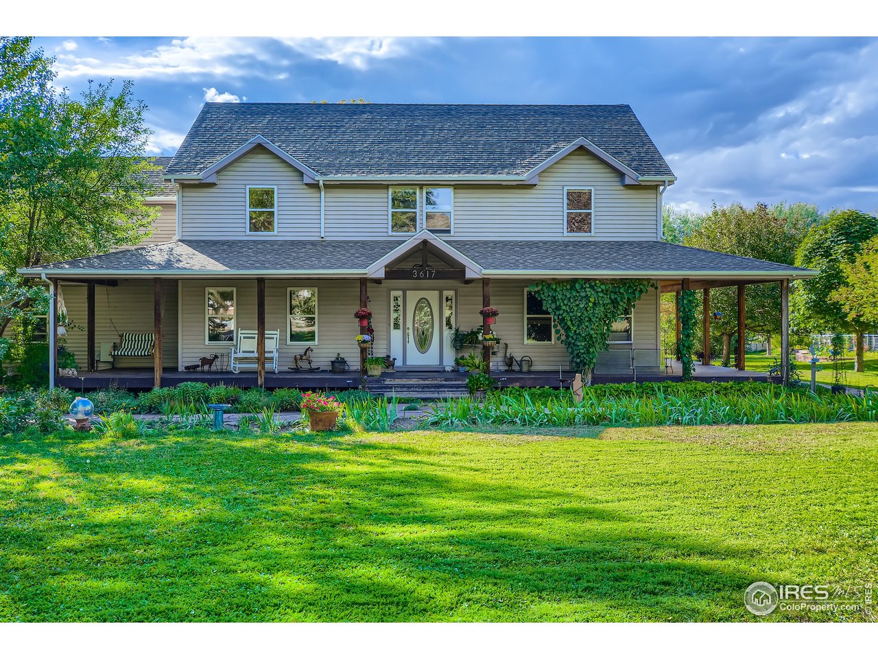 3617 Glade Road Loveland, CO 80538 - Photo 1 of 50 Awesome Farmhouse with Wrap-Around Porch!