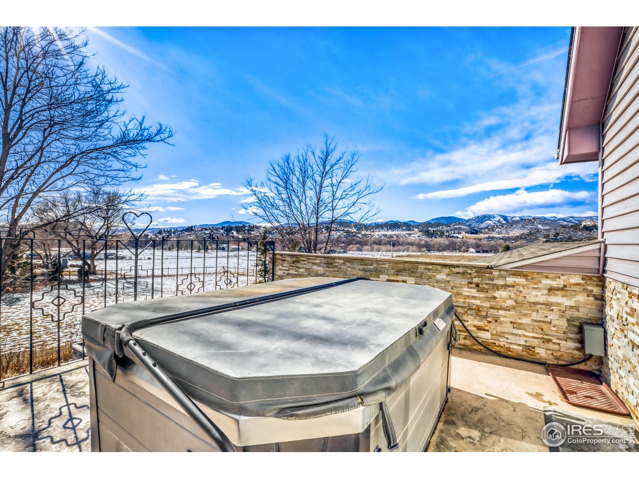 3617 Glade Road Loveland, CO 80538 - Photo 32 of 50 Enjoy the Mountain Views from the privacy of your Hot Tub on a Deck connected directly to the Primary Bedroom!