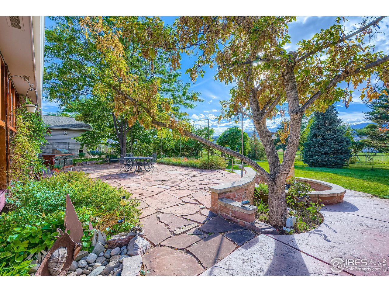 3617 Glade Road Loveland, CO 80538 - Photo 41 of 50 Gorgeous flagstone patio with water feature in backyard