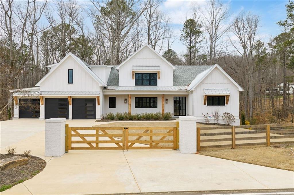 555 Lower Birmingham Road Canton, GA 30115 - Photo 4 of 104 a front view of a house with a yard