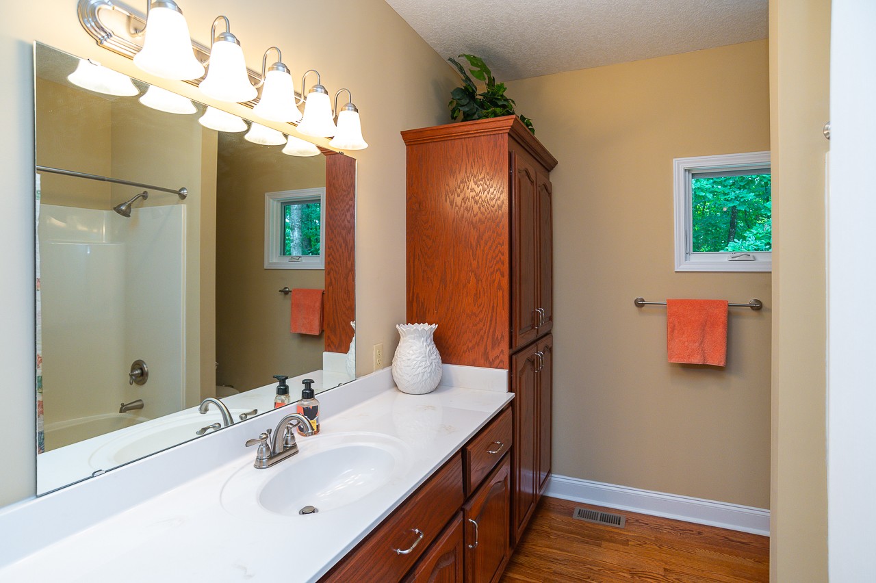 41 Arnold Road Flintville, TN 37335 - Photo 15 of 41 a bathroom with a double vanity sink mirror and shower
