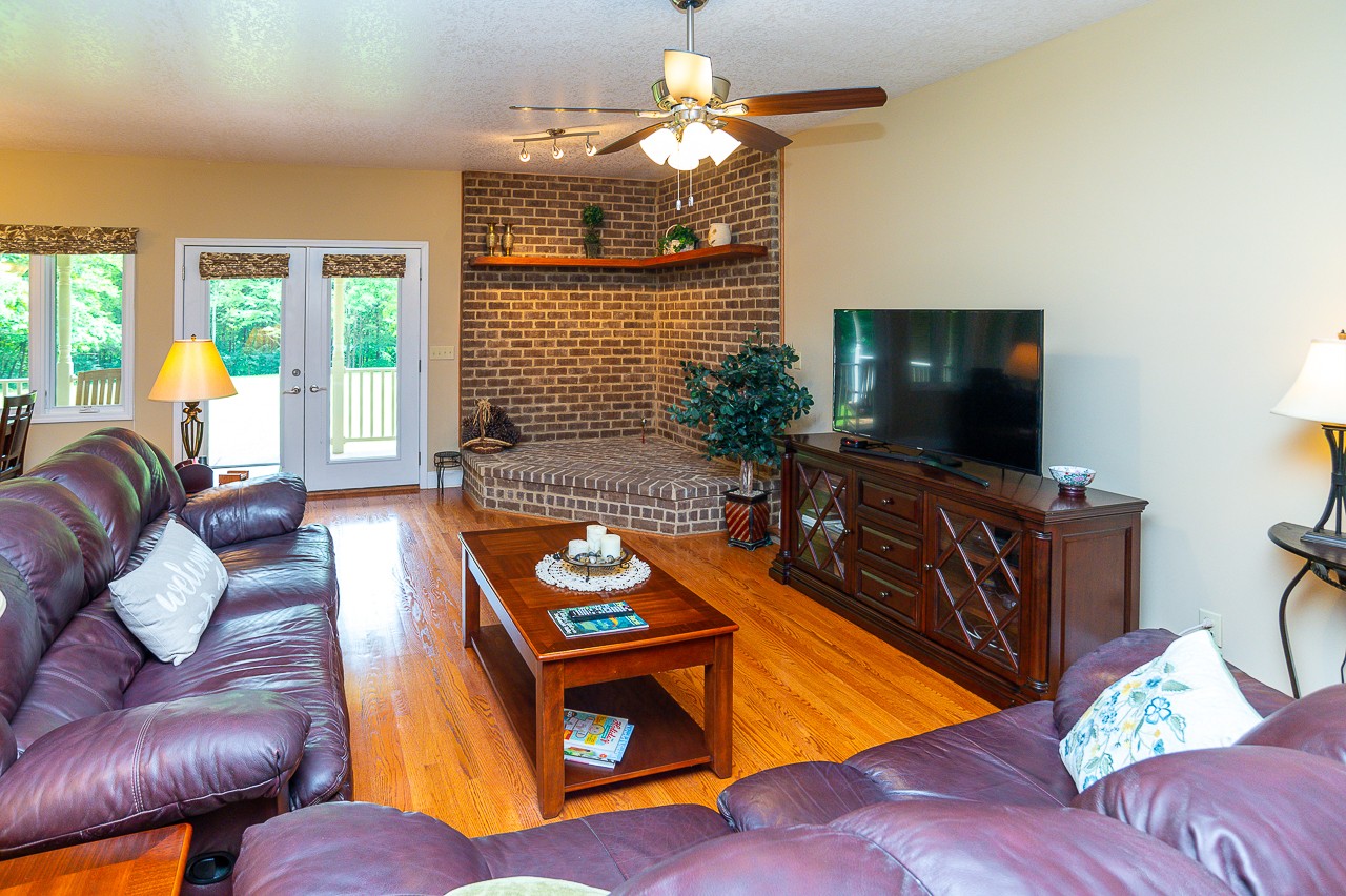 41 Arnold Road Flintville, TN 37335 - Photo 20 of 41 a living room with furniture a flat screen tv and a large window