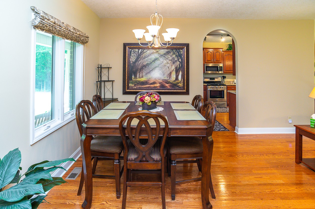 41 Arnold Road Flintville, TN 37335 - Photo 24 of 41 a view of a dining room with furniture a chandelier and wooden floor