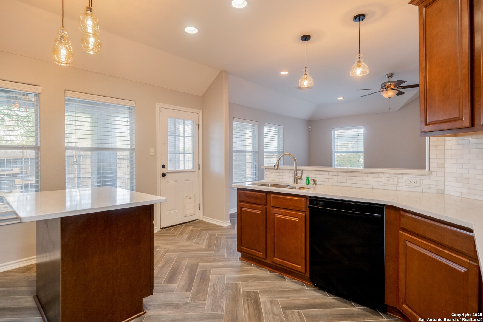 206 Club View West Seguin, TX 78155 - Photo 12 of 36 a large kitchen with granite countertop a sink and dishwasher a black granite counter top