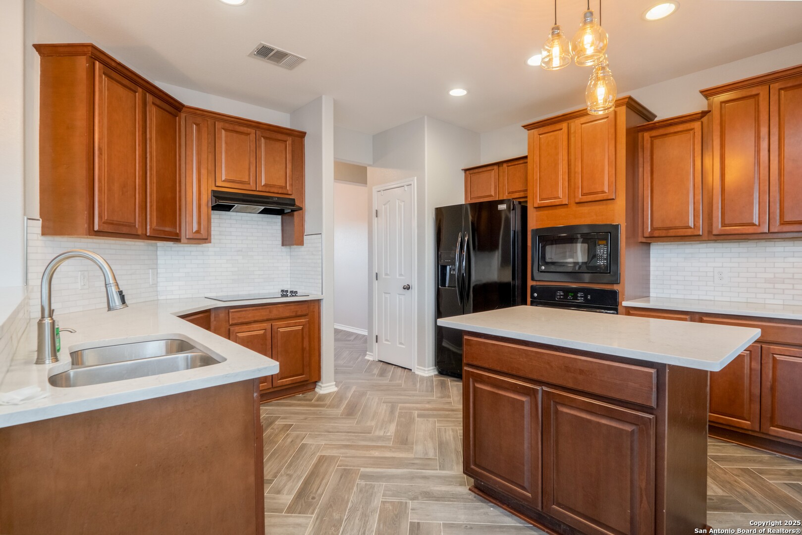 206 Club View West Seguin, TX 78155 - Photo 10 of 36 a kitchen with stainless steel appliances granite countertop a sink stove and refrigerator